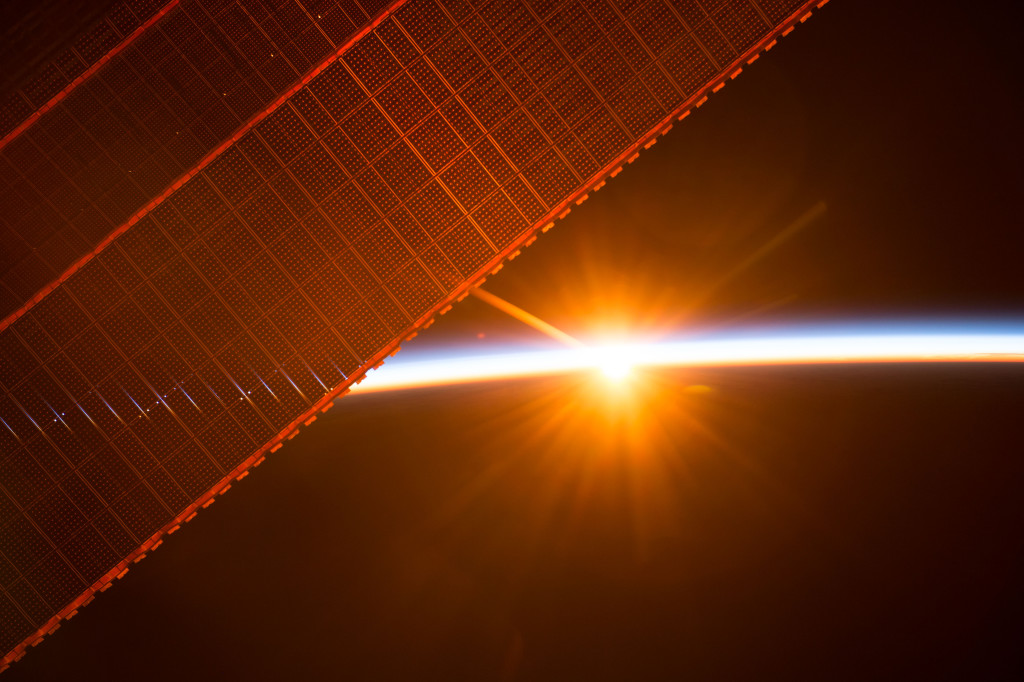 Fig. 1. Sunrise through the solar arrays, International Space Station [9]